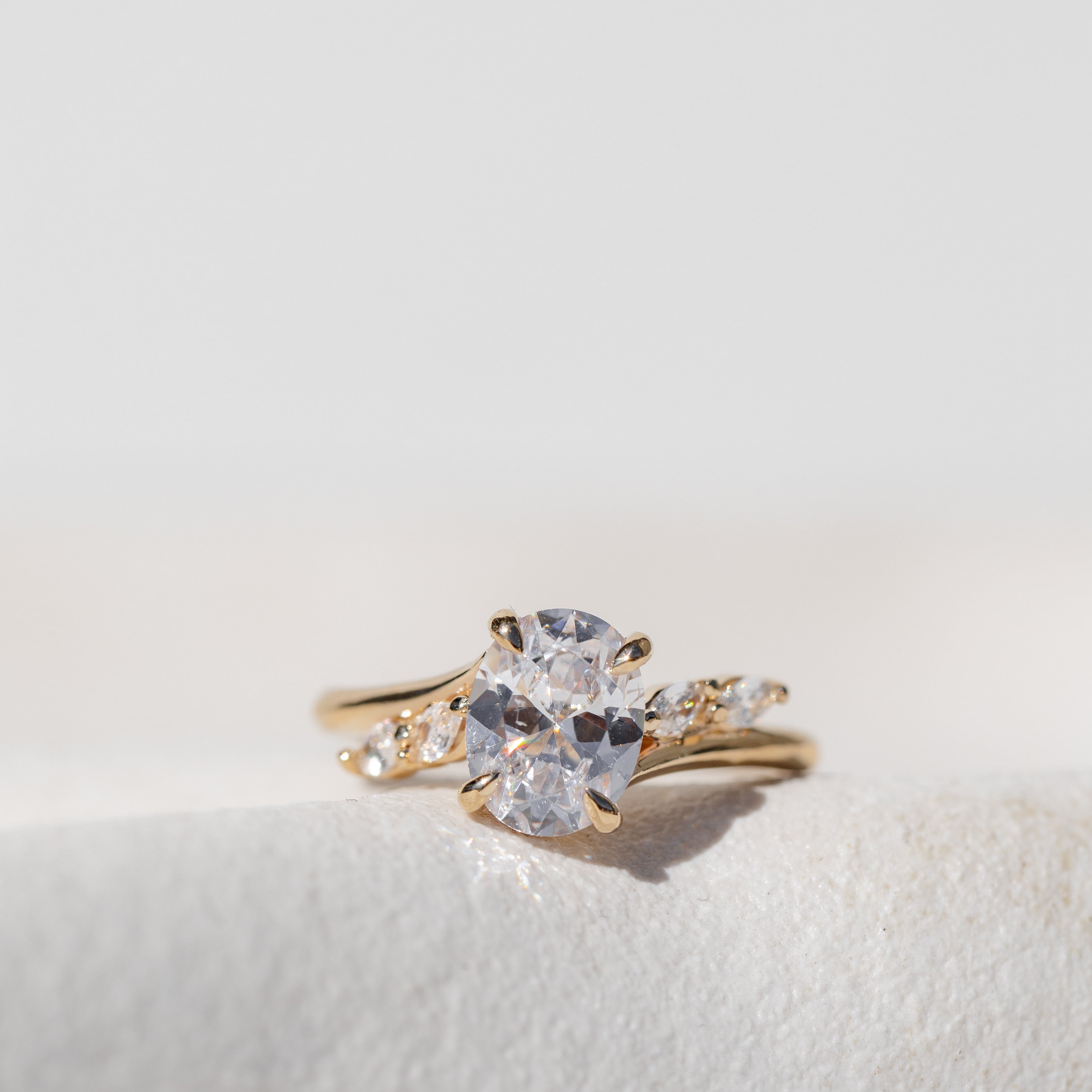 Oval Cut Diamond Engagement Ring with Marquise Cut Side Stones