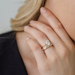 Oval Cut Diamond Solitaire engagement ring with bezel set emerald cut diamond wedding ring
