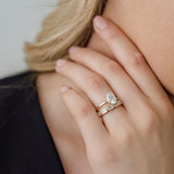 Oval Cut Diamond Solitaire engagement ring with bezel set emerald cut diamond wedding ring
