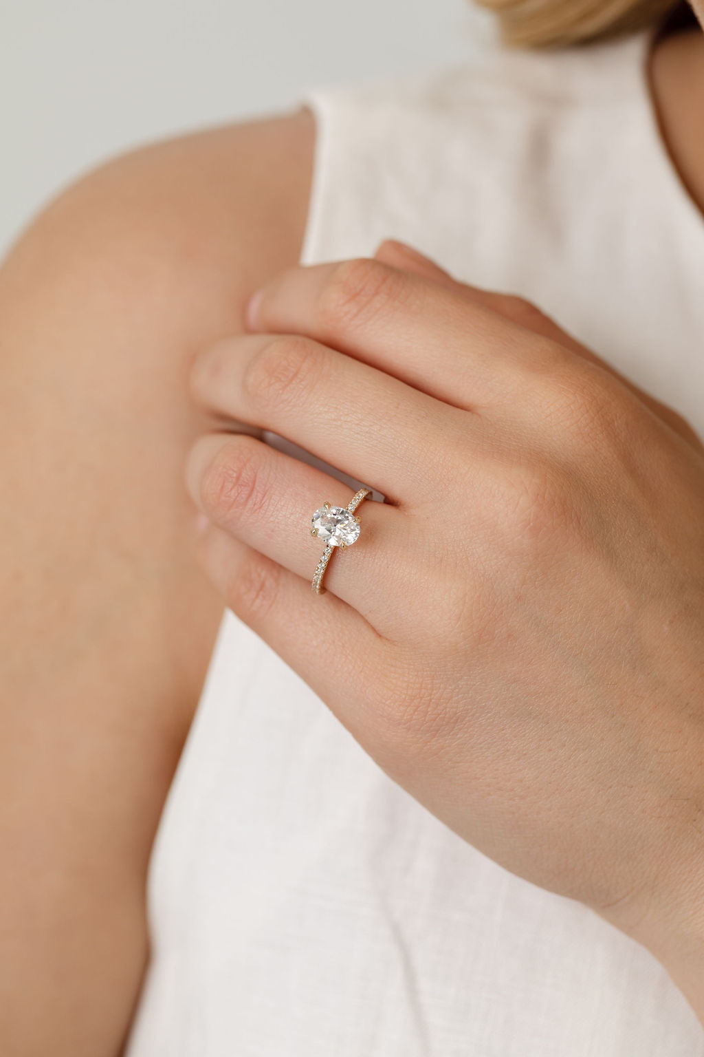 Oval Legacy engagement ring with diamonds in the band