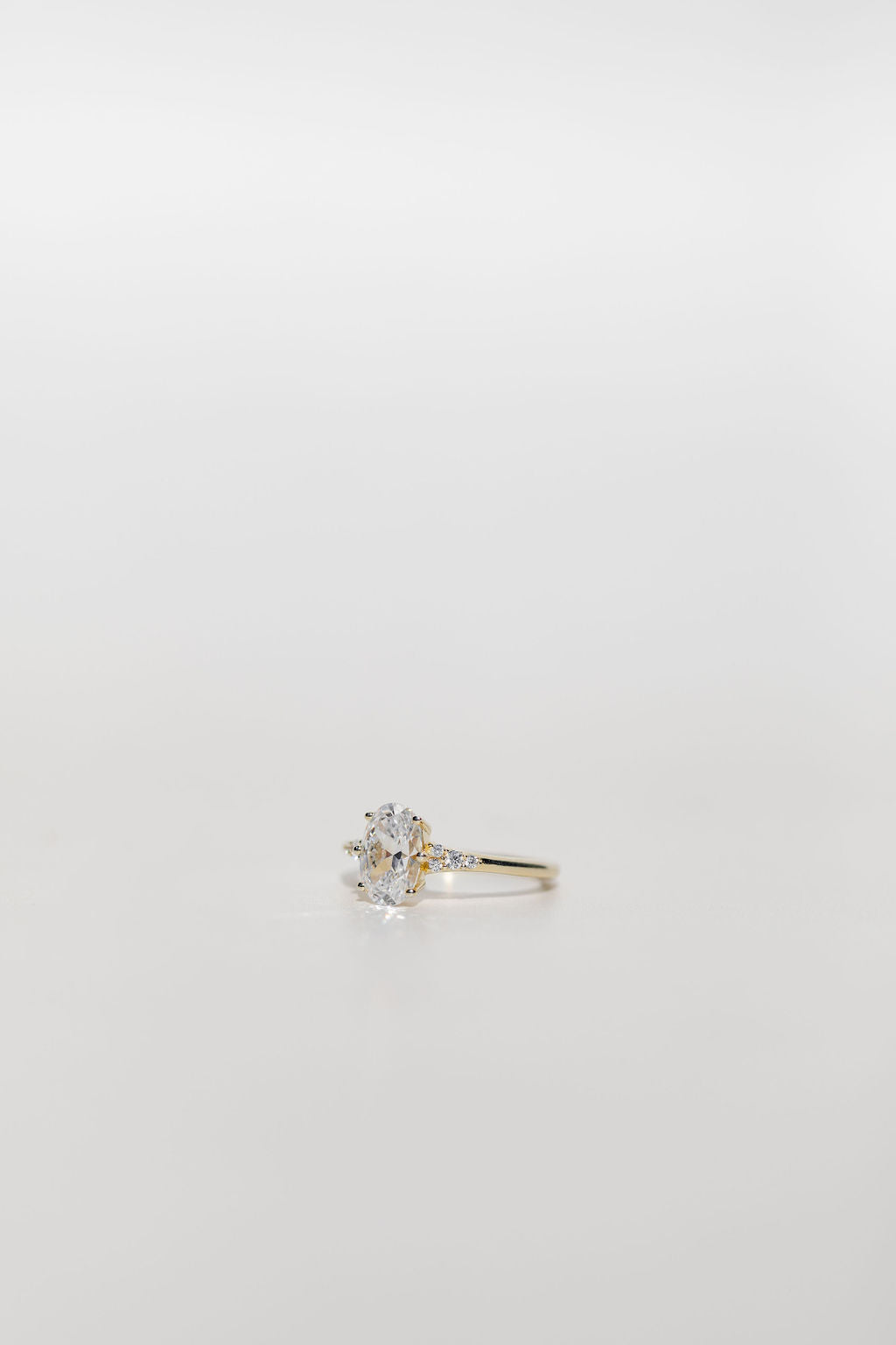 Oval cut diamond engagement ring with diamond accent stones