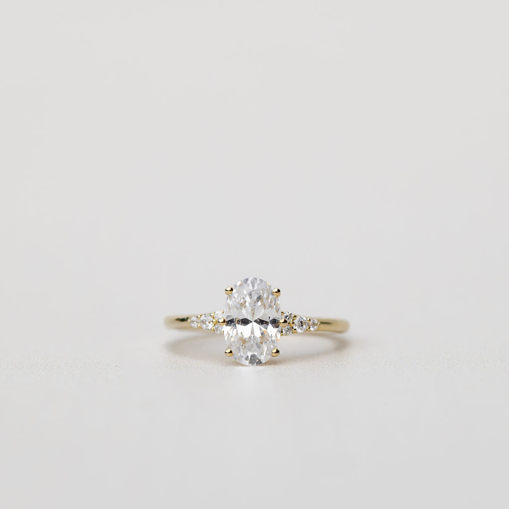 oval engagement ring with diamonds on the band