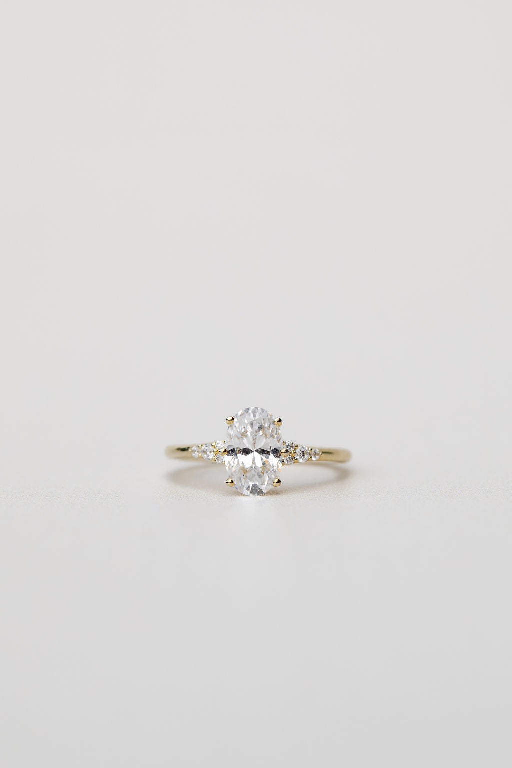 oval engagement ring with diamonds on the band