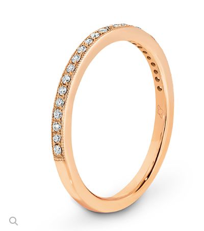Pave set diamonds and a millgrain edge wedding ring  rose gold 