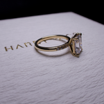 Radiant diamond with side stone engagement ring