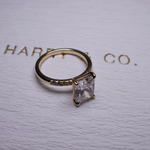 Radiant with side stone engagement ring y