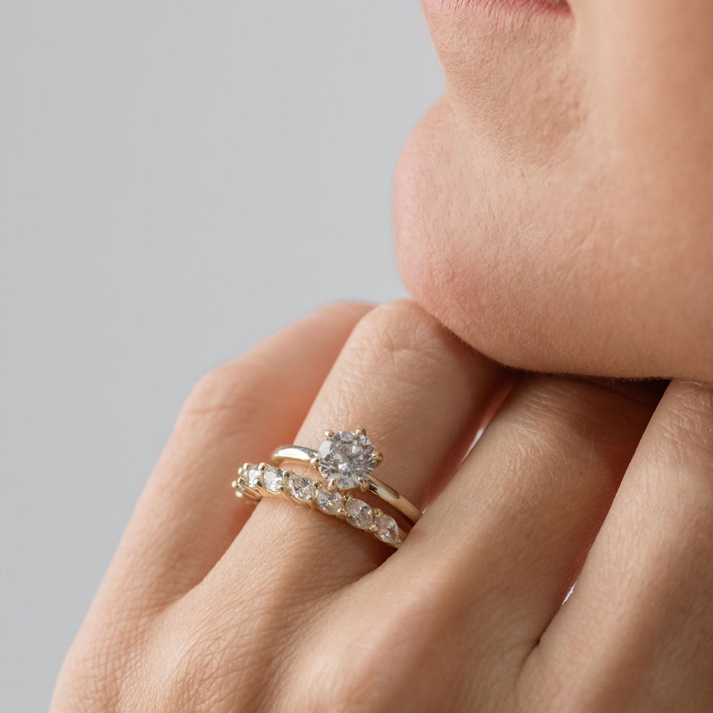 Round Brilliant Cut Solitaire engagement ring with marquise cut diamond wedding ring