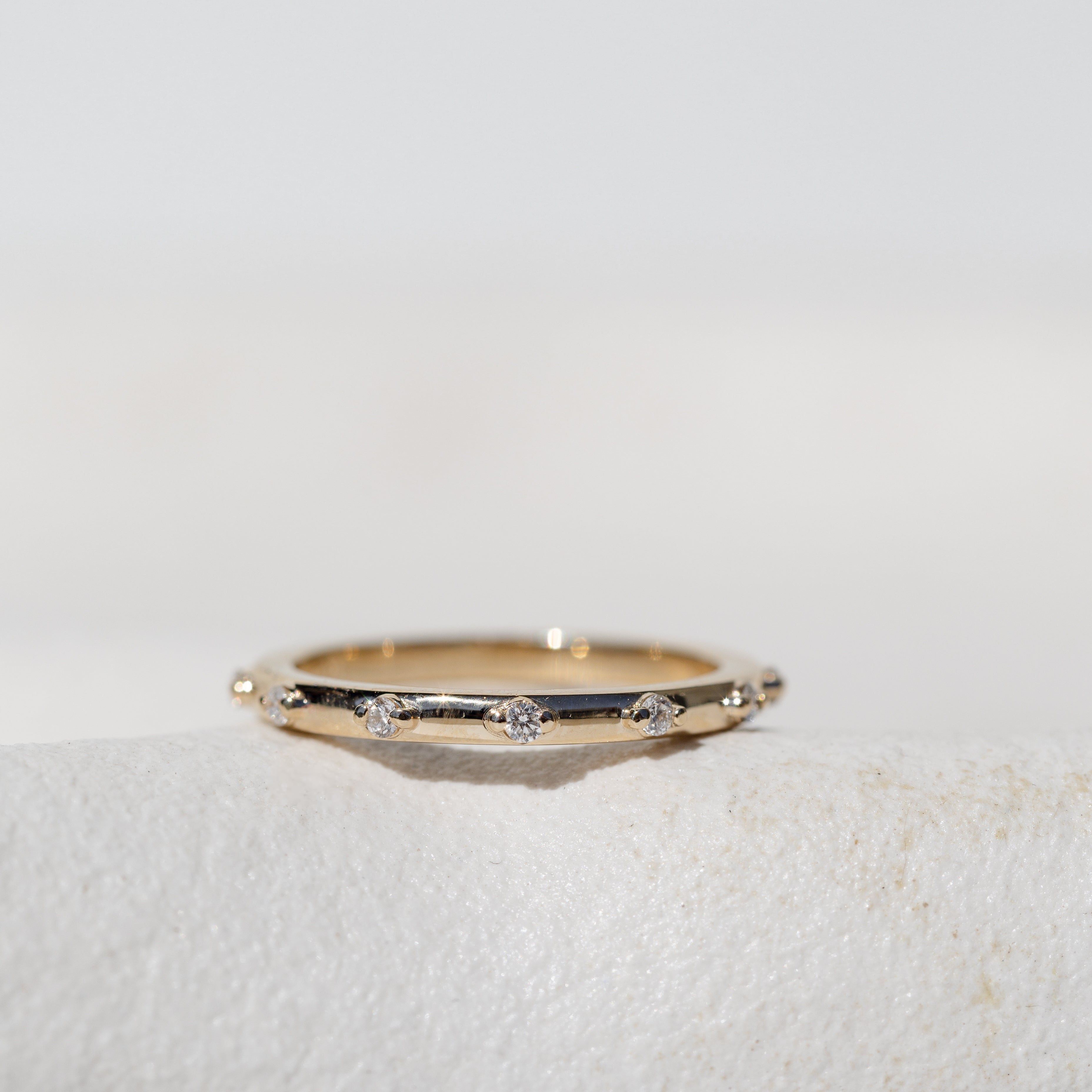 Spaced Diamond Band in yellow gold 