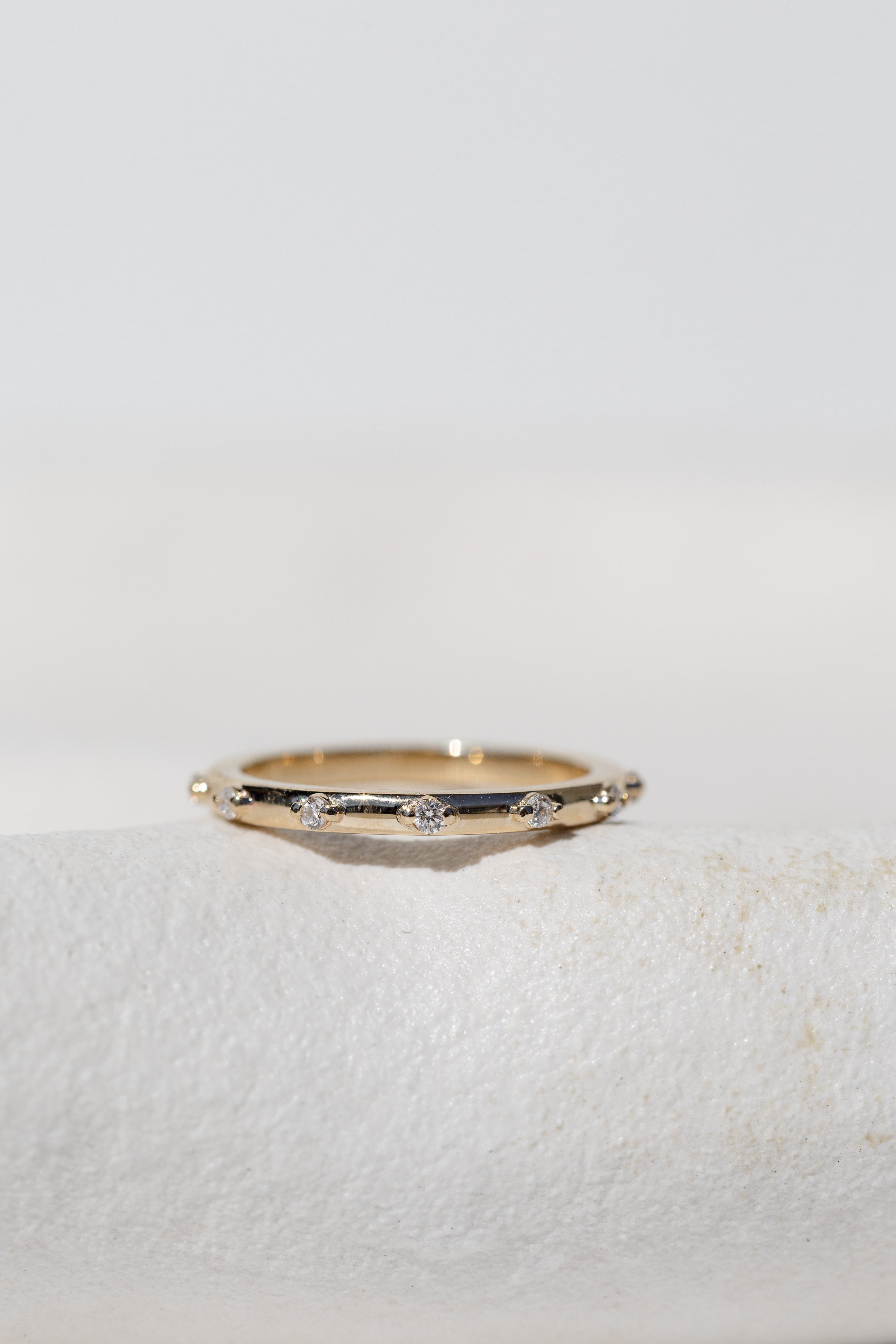 Spaced Diamond Band in yellow gold 