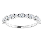 Statement diamond eternity ring in white gold with two sized diamonds 