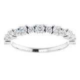 Statement diamond eternity ring in white gold with two sized diamonds 