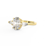 Three Stone Trilogy Diamond engagement ring with oval cut diamond centre stone and pear cut diamond side stones