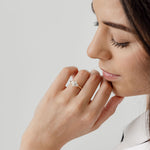 Three stone diamond engagement ring with marquise centre stone and half moon cut diamond side stones