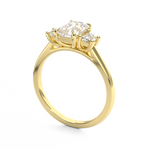 Three stone trilogy engagement ring with emerald cut centre Harry and Co