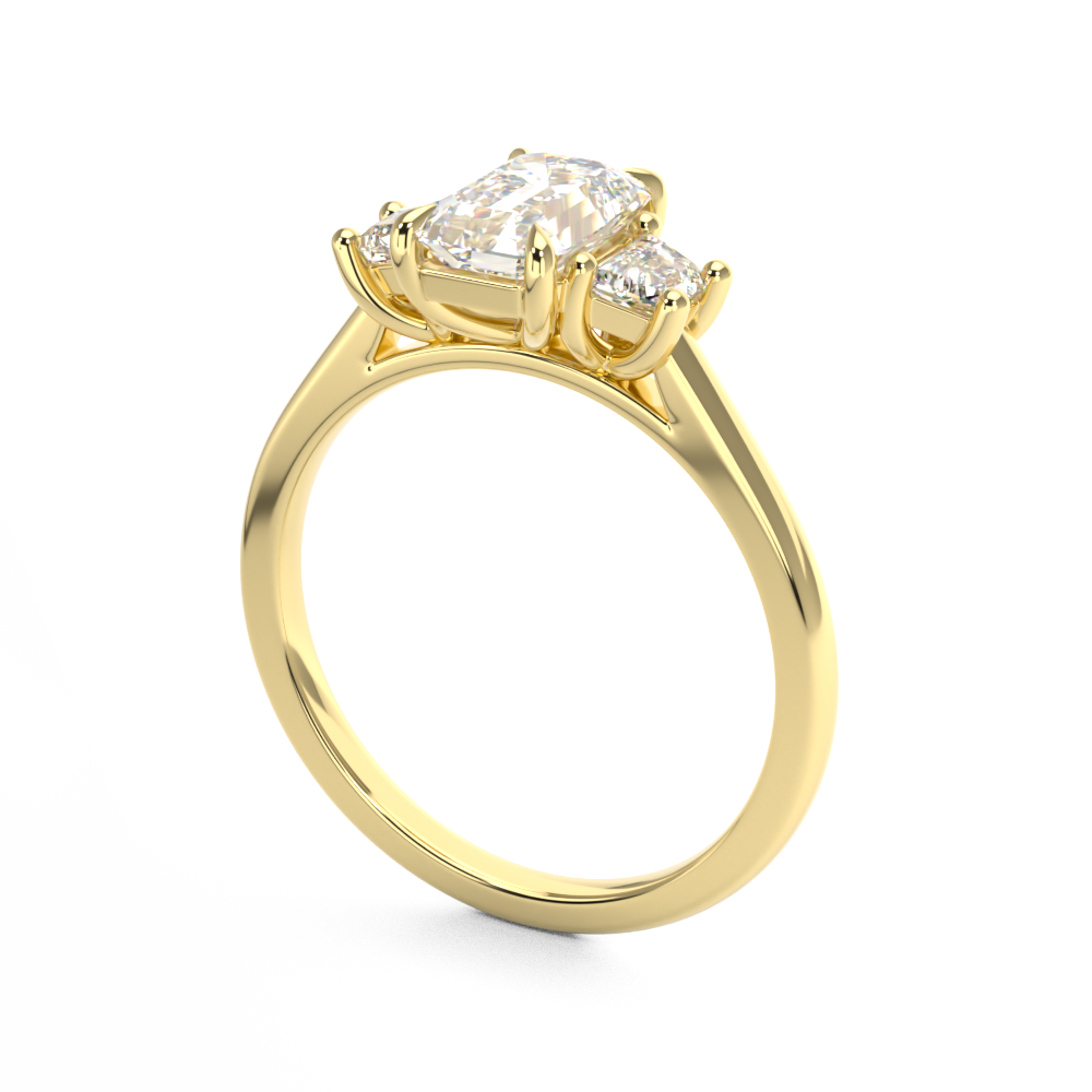 Three stone trilogy engagement ring with emerald cut centre Harry and Co