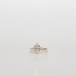 Three stone diamond engagement ring with marquise centre stone and half moon cut diamond side stones