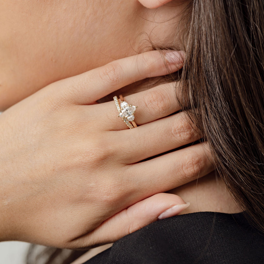 Three stone diamond engagement ring with marquise centre stone and half moon cut diamond side stones