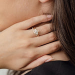 Three stone diamond engagement ring with marquise centre stone and half moon cut diamond side stones