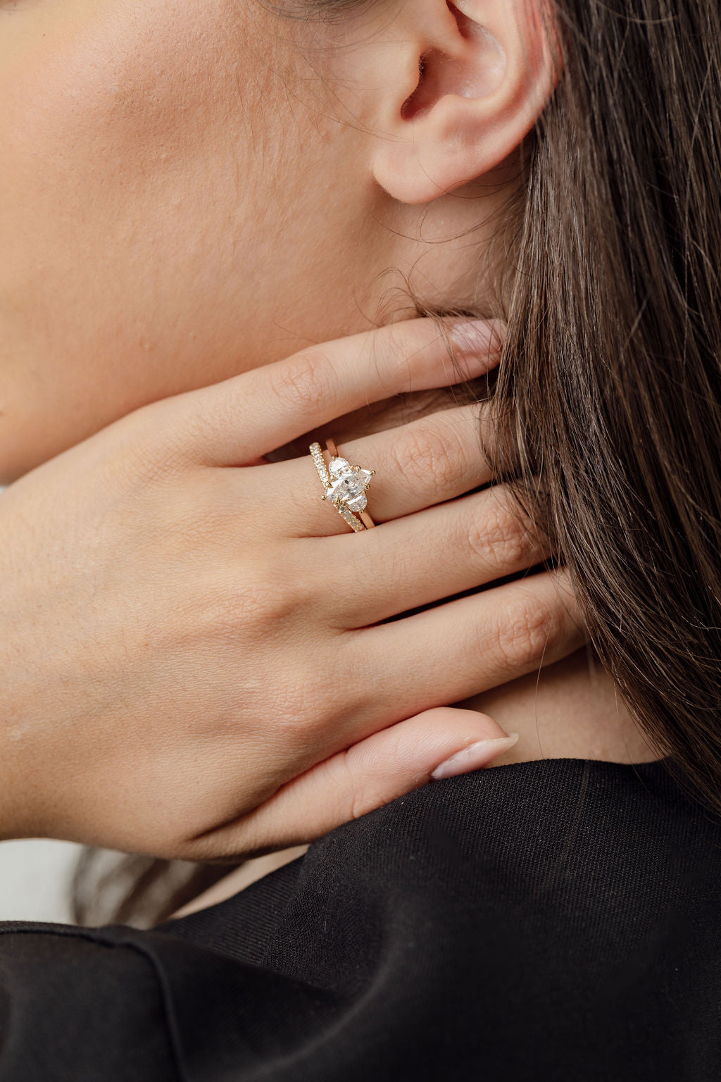 Three stone diamond engagement ring with marquise centre stone and half moon cut diamond side stones