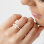 Three stone diamond engagement ring with marquise centre stone and half moon cut diamond side stones