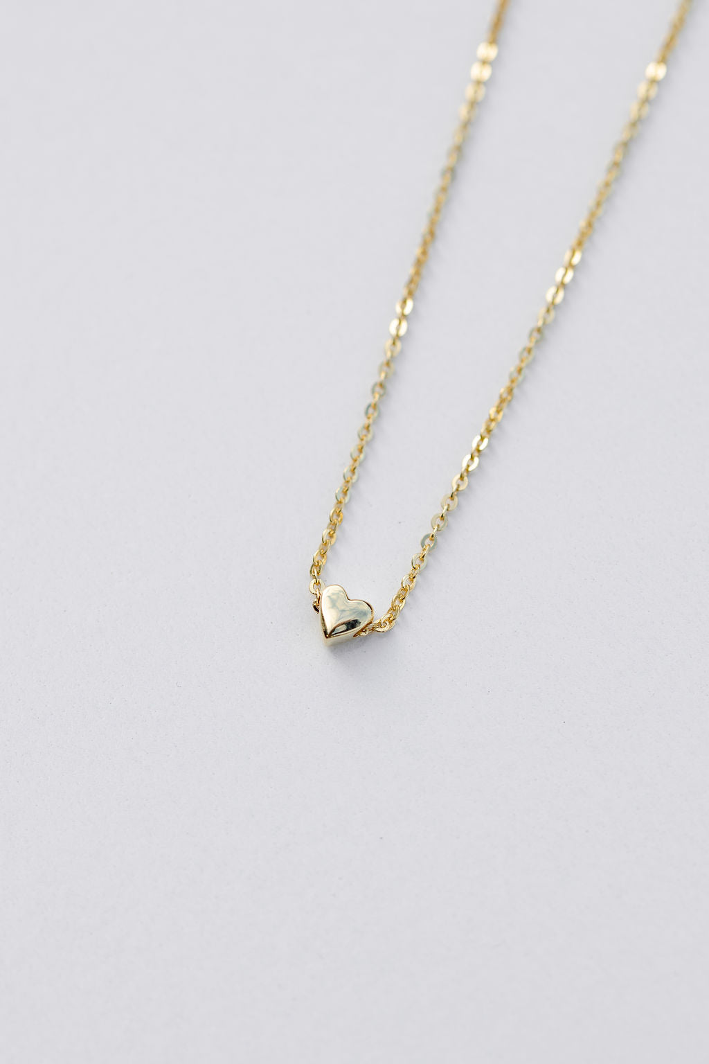 Tiny heart pendant necklace in yellow gold 