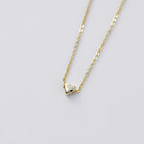 Tiny heart pendant necklace in yellow gold 