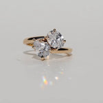 Toi et moi diamond engagement ring with oval cut diamond and pear cut diamond
