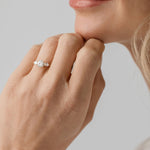 three stone trilogy ring with pear side stones