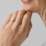 three stone trilogy ring with pear side stones