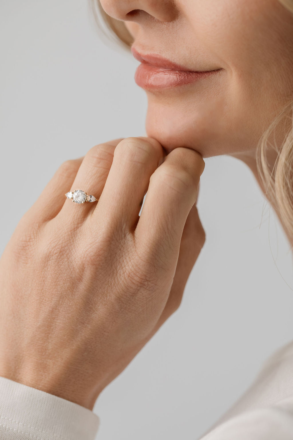 three stone trilogy ring with pear side stones