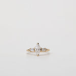 Trilogy three stone ring with marquise diamond centre