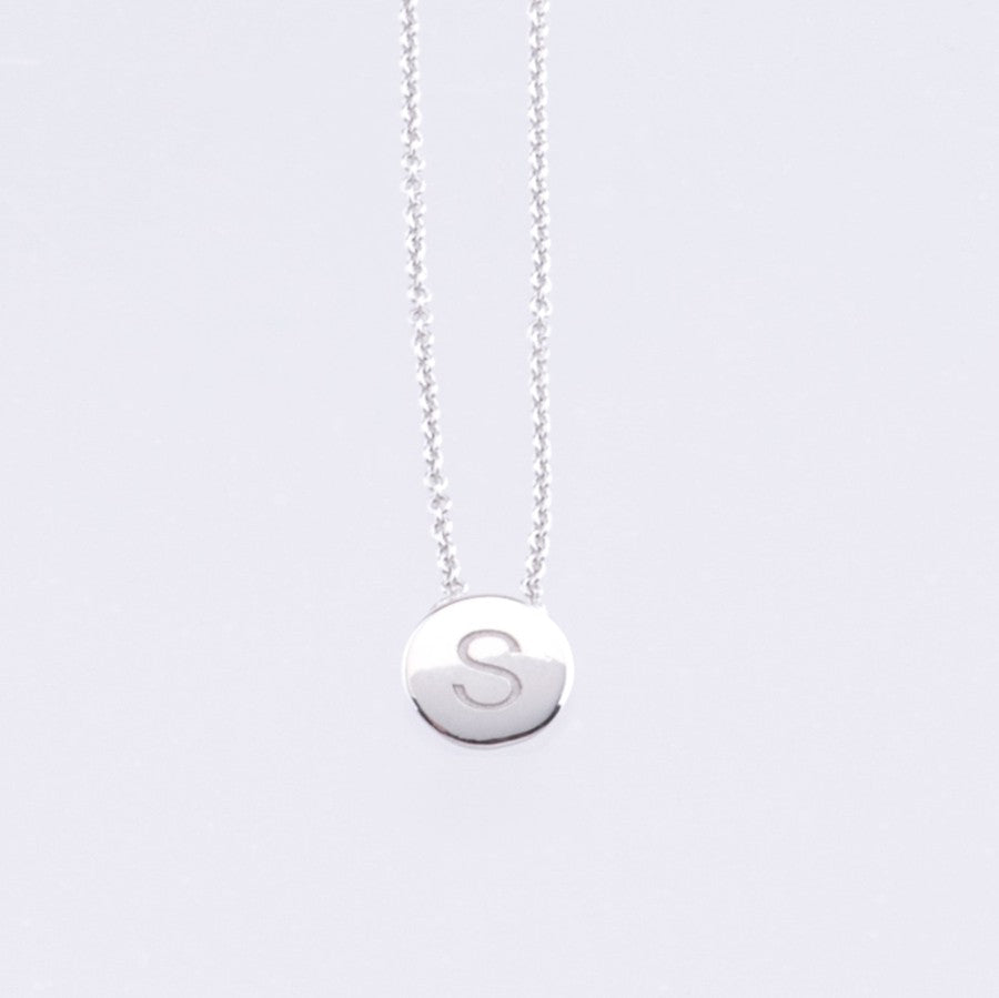 White gold disc pendant with engraved letter 1