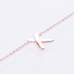 X bracelet rose gold 
