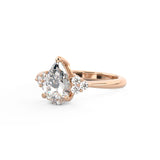 Alicia Pear Shape diamond engagement ring with round diamond clusters