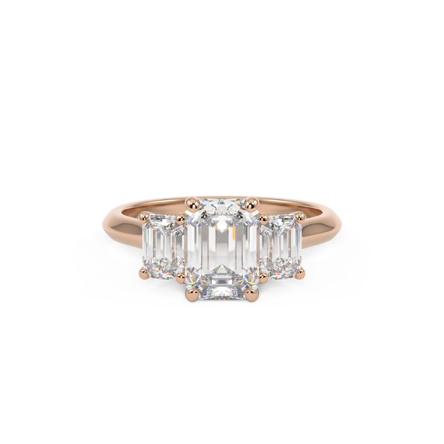 Trilogy three stone ring with three emerald cut diamonds in rose gold