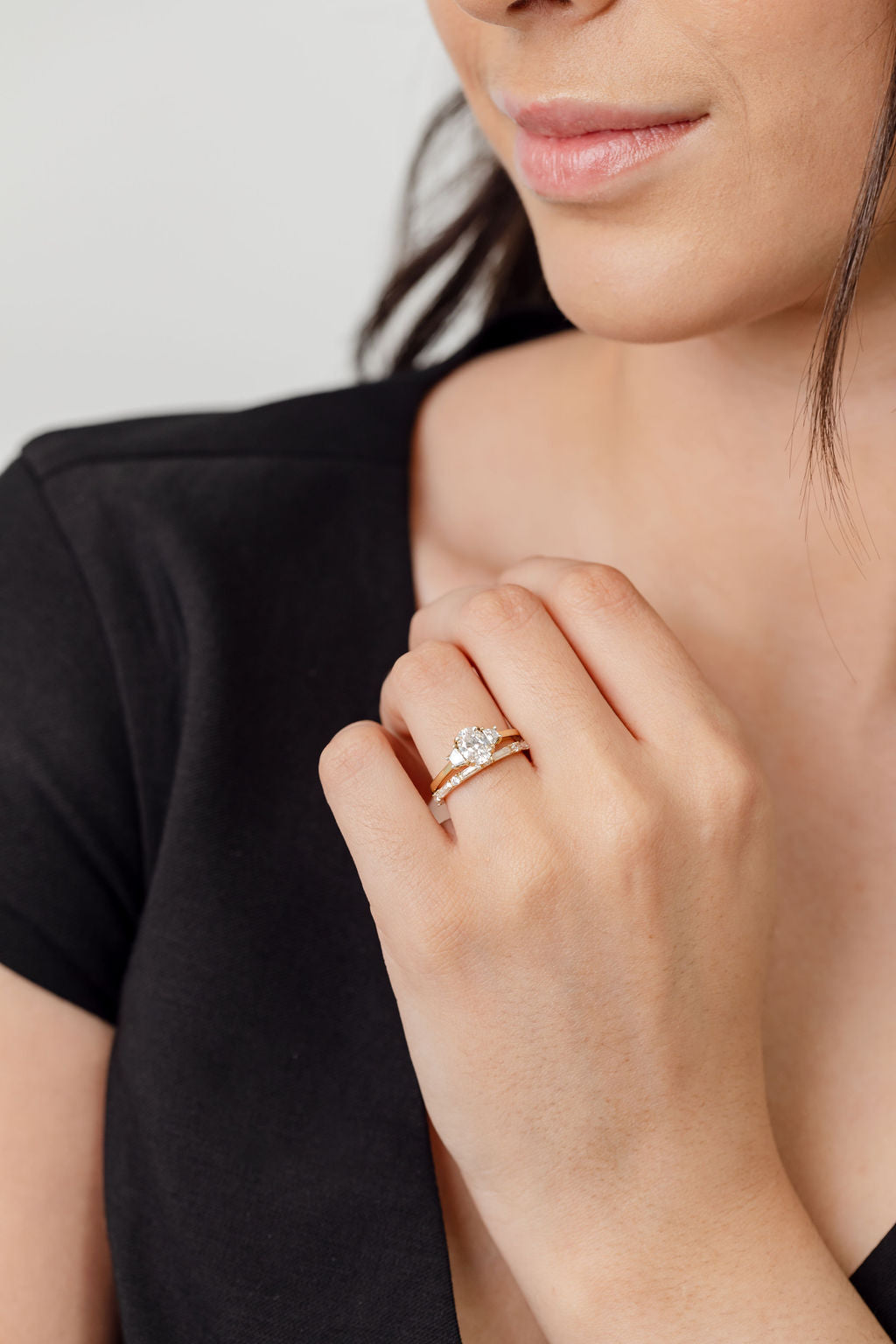 baguette and round diamond wedding ring with oval three stone engagement ring