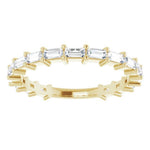  baguette diamond claw set eternity ring in yellow gold 