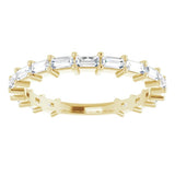  baguette diamond claw set eternity ring in yellow gold 