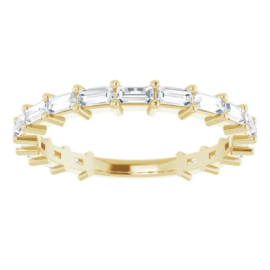  baguette diamond claw set eternity ring in yellow gold 