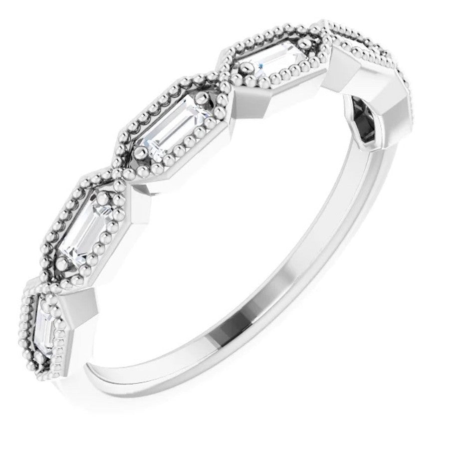 white gold diamond eternity ring with baguette cut diamonds and millgrain edge