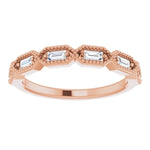 rose gold diamond wedding ring with baguette cut diamonds and millgrain edge