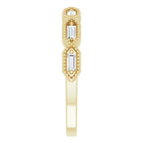yellow gold diamond eternity ring with baguette cut diamonds and millgrain edge
