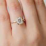 bezel set emerald cut diamond engagement ring