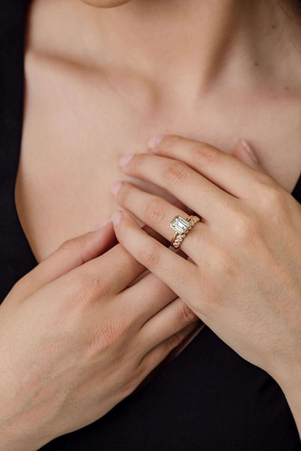 bezel set emerald cut diamond engagement ring with bezel set oval cut diamond wedding ring
