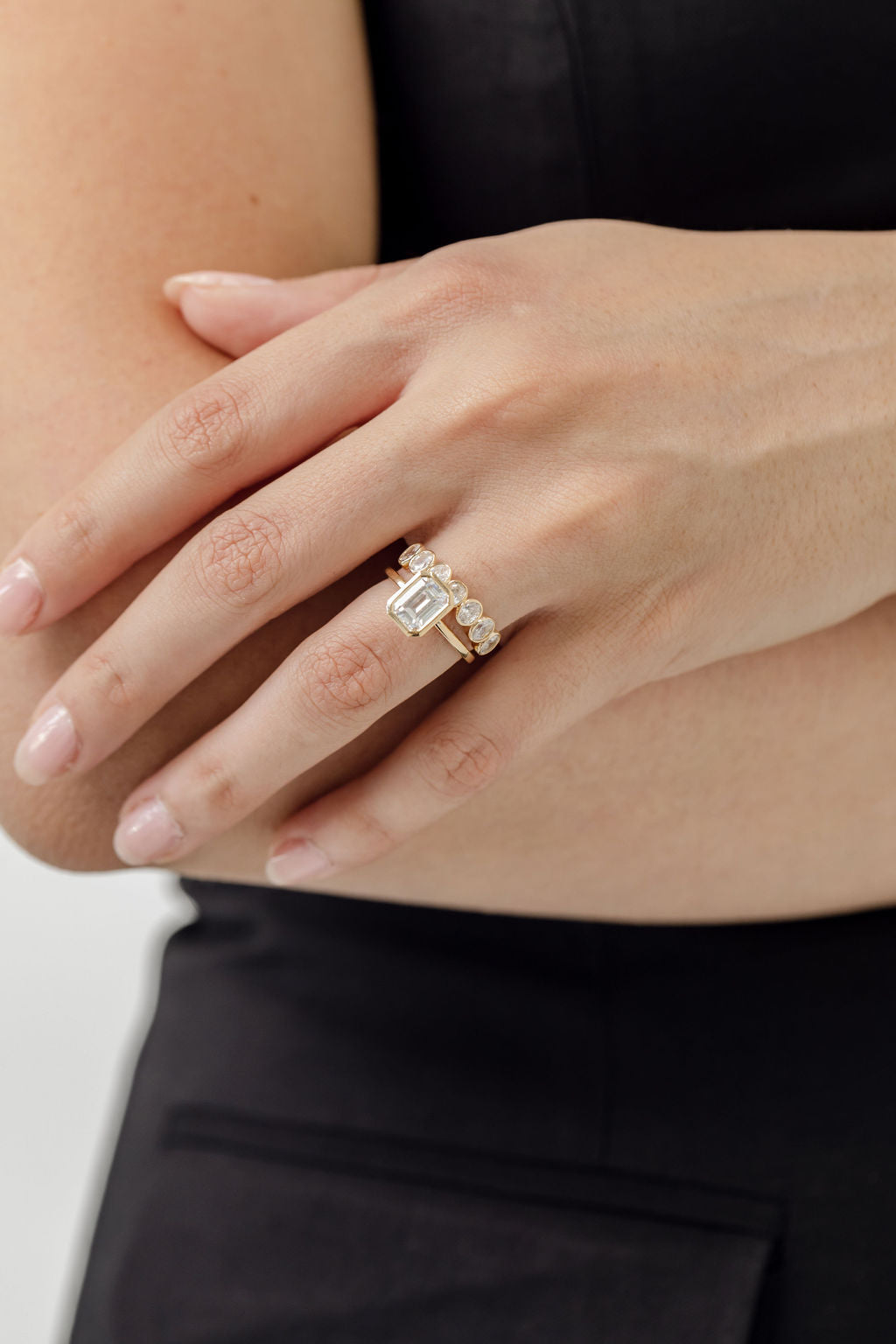 bezel set emerald cut engagement ring with bezel set oval cut diamond wedding ring