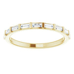 yellow gold eternity ring with baguette cut diamonds