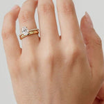 chunky gold wedding ring with oval engagement ring