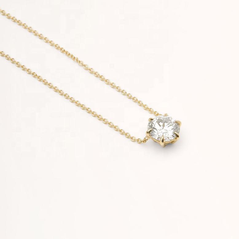 yellow gold claw set diamond pendant
