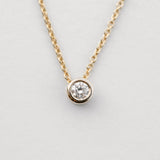 diamond bezel set necklace in yellow gold