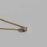 diamond bezel set necklace in gold